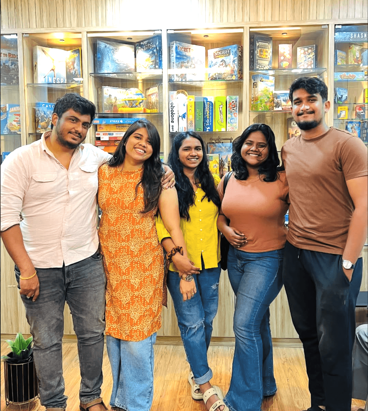 Friends playing board games at a cozy table
